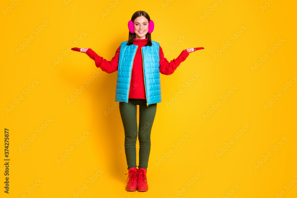Full length photo positive girl hold hand demonstrate adverts promo present black friday choice decision advice wear blue green pink sweater boots isolated bright shine color background Full length photo positive girl hold hand demonstrate adverts promo present black friday choice decision advice wear blue green pink sweater boots isolated bright shine color background