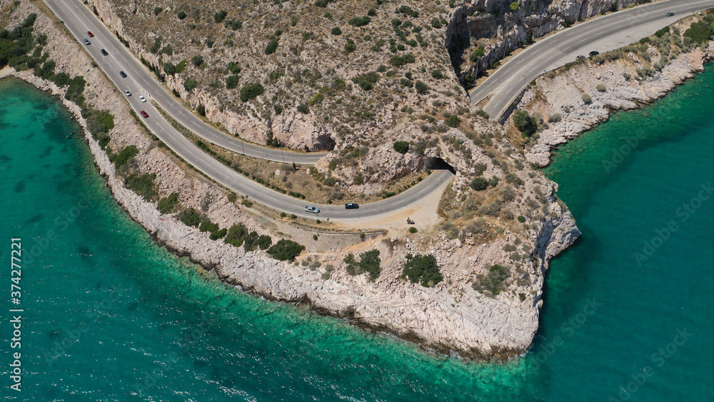 Fototapeta premium Aerial drone photo of Tunnel in Athens riviera seaside road known as hole of Karamanlis or 