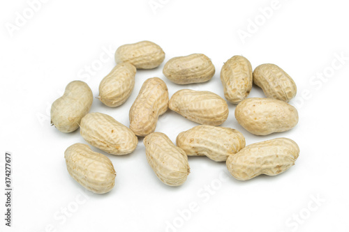 Fresh peanuts isolated on a white background.