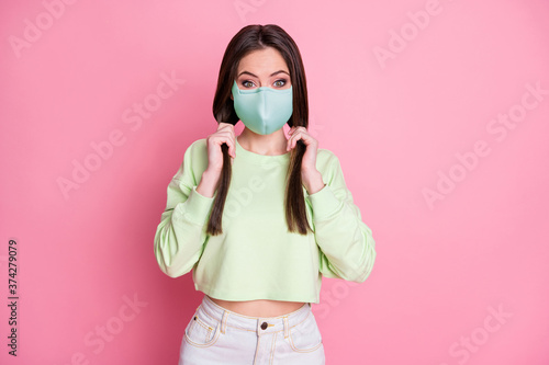 Portrait of her she attractive funky amazed healthy straight-haired girl wearing safety reusable textile mask stop pandemia influenza flu flue grippe disease isolated pink pastel color background