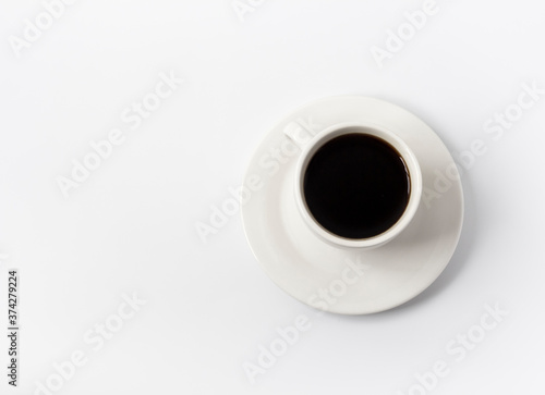 white Cup with black coffee on a white background with a copy of the space