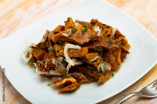 Delicious salted mushrooms with onions and dill. High quality photo