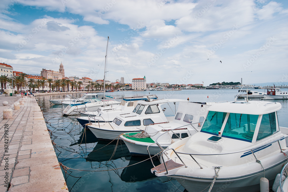 Fototapeta premium Travel by Croatia. Beautiful landscape with Split Old Town on sea shore. Boats at the harbour.