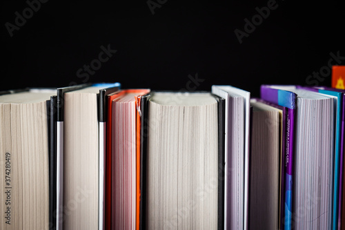 Collection books on black background.