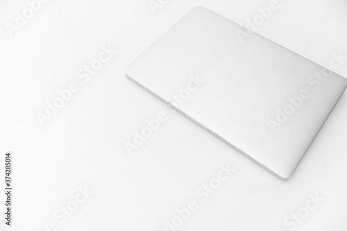 modern closed laptop isolated on white with copy  space