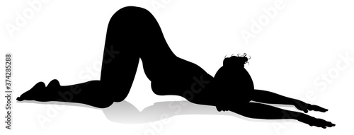 A silhouette of a woman in a yoga or pilates pose