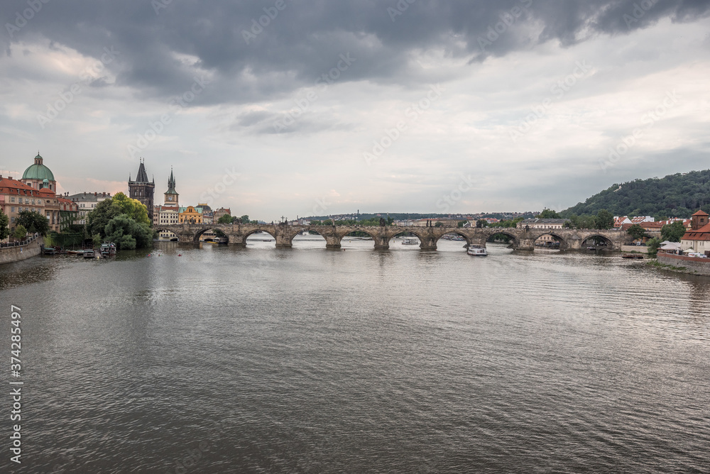 Charles Bridge (Karluv Most), as seen from  Manes Bridge, most famous historic sandstone bridge over Vltava river in Prague, most visited site in Prague, Czech Republic.