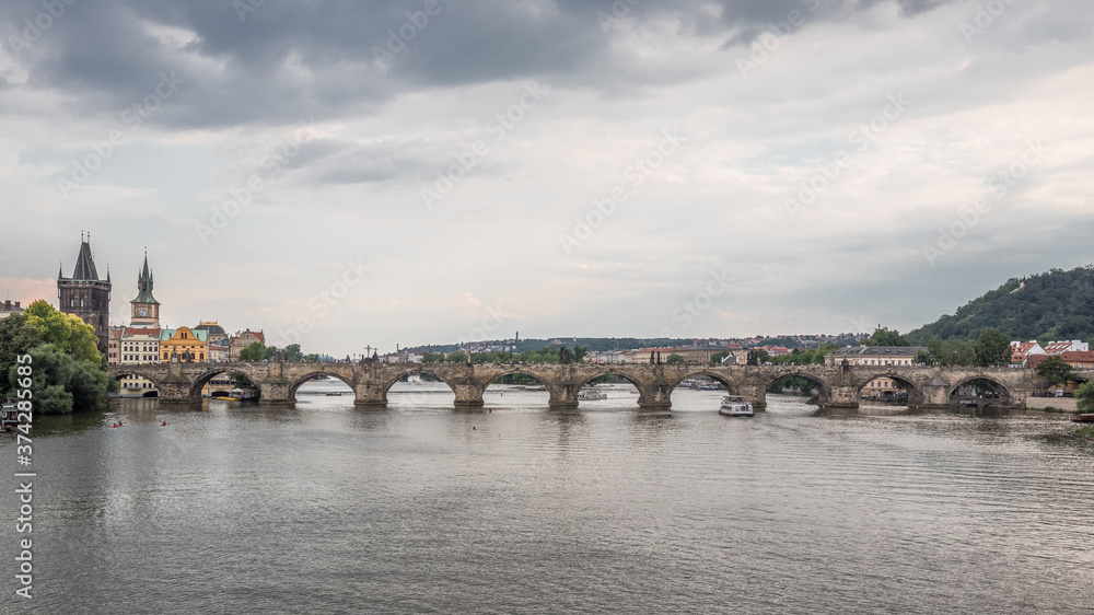 Charles Bridge (Karluv Most), as seen from  Manes Bridge, most famous historic sandstone bridge over Vltava river in Prague, most visited site in Prague, Czech Republic.