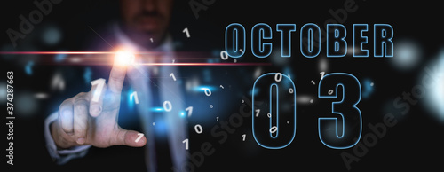 october 3rd. Day 3 of month, announcement of date of business meeting or event. businessman holds the name of the month and day on his hand. autumn month, day of the year concept