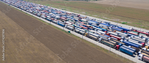 Trucks stand in line to the terminal. © maykal