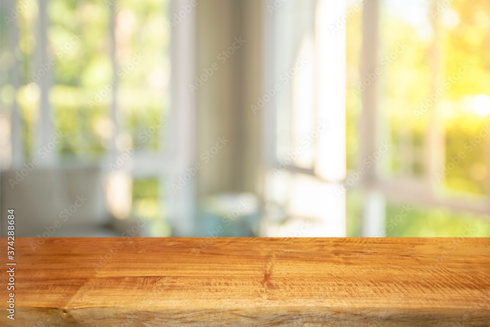 Display products on a brown wooden table in a bright white room in the morning Display products on a brown wooden table in a bright white room in the morning