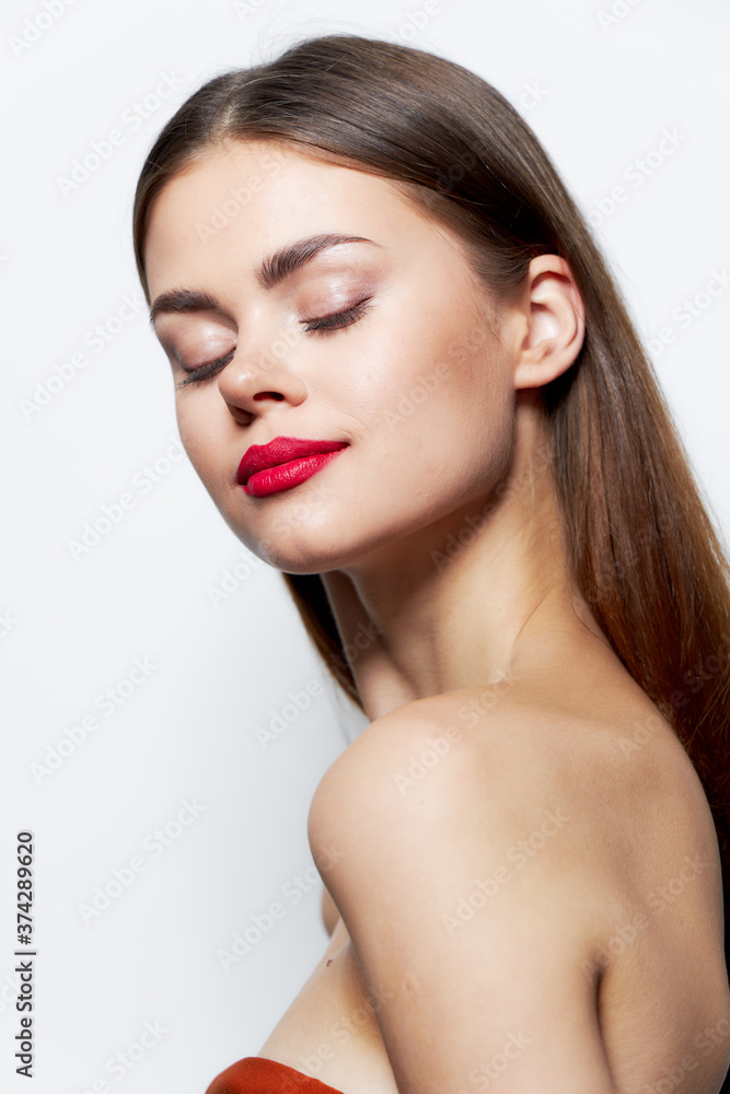 Fototapeta premium Girl Naked shoulders red lips closed eyes clear skin care