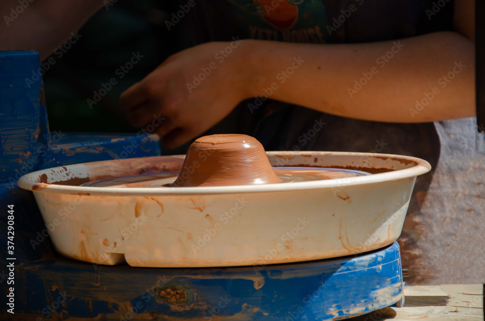 Pottery hand circle clay. Learning pottery hobby background.