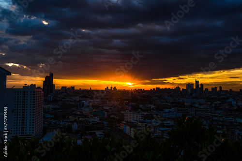 The high angle background of the city view with the secret light of the evening  blurring of night lights  showing the distribution of condominiums  dense homes in the capital community