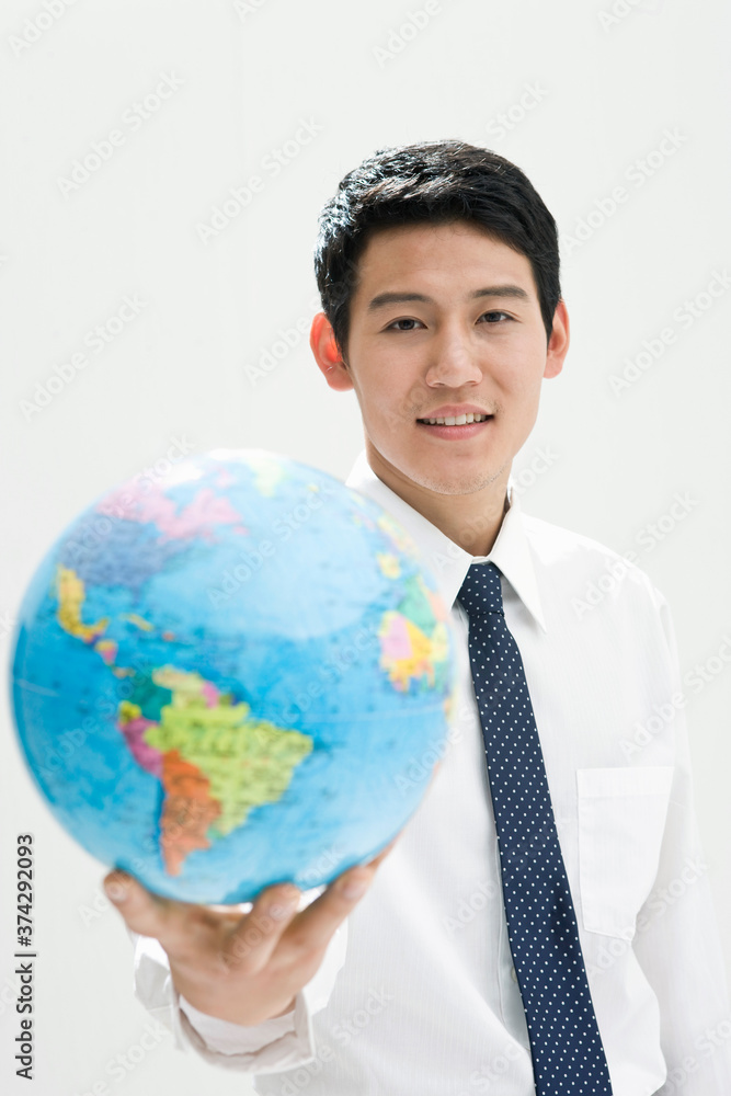 business man holding globe business man holding globe