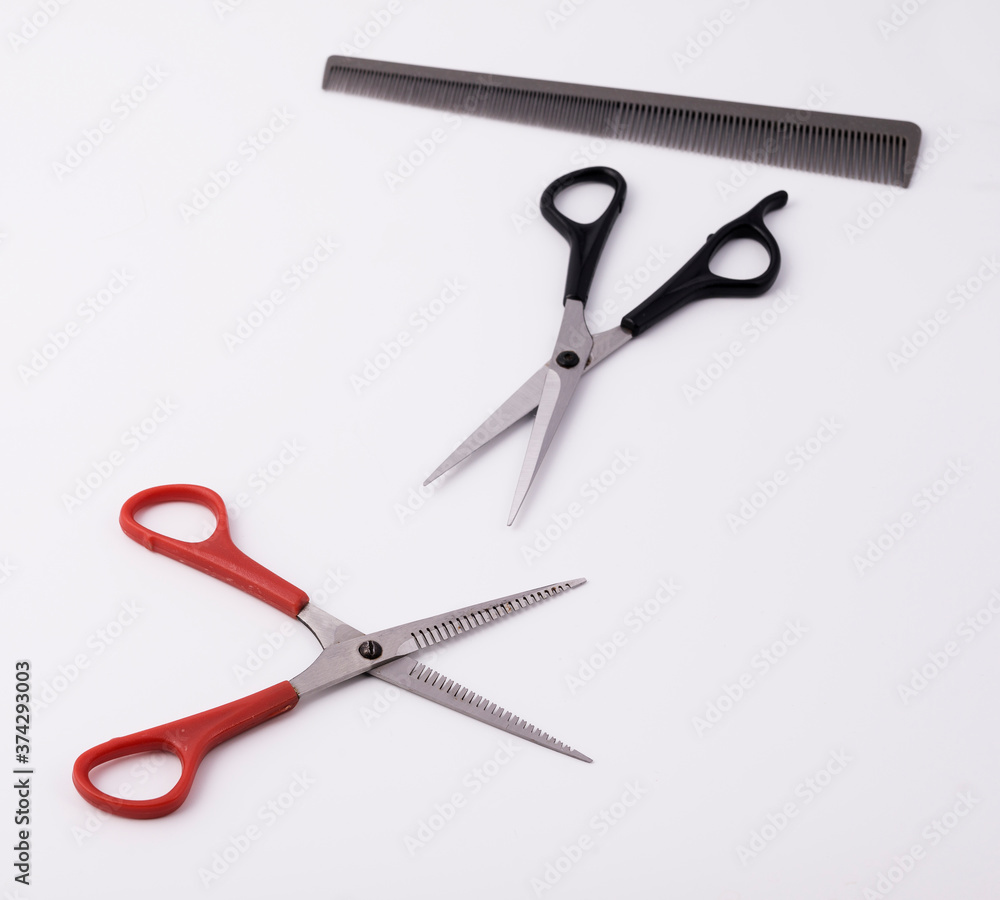 Hair clippers and comb on a white background. Hair clippers and comb on a white background.