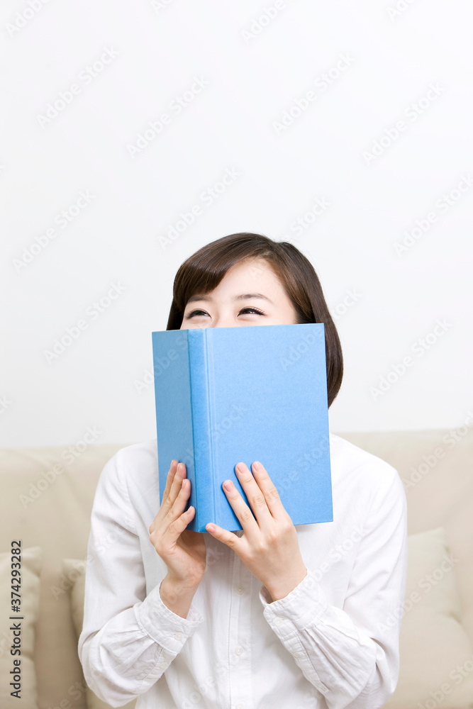 young woman holding a book young woman holding a book