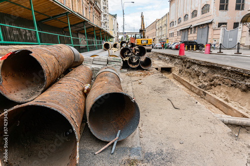 Kyiv (Kiev), Ukraine - 13 August, 2020: Replacement of old rusty pipes (plumbing) for the new ones on the street, serious and extensive work which causes a lot of temporary inconveniences