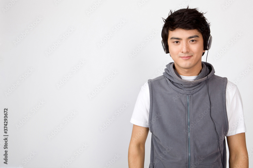 young man wearing headphones young man wearing headphones