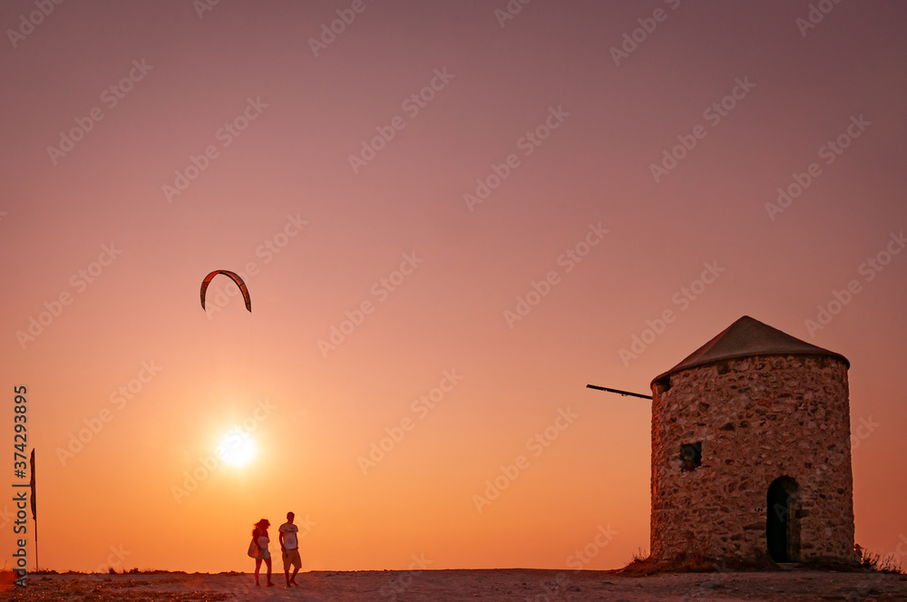 Fototapeta premium Lefkada, Greece. August 18th, 2011. Two boys as they leave Milos beach.