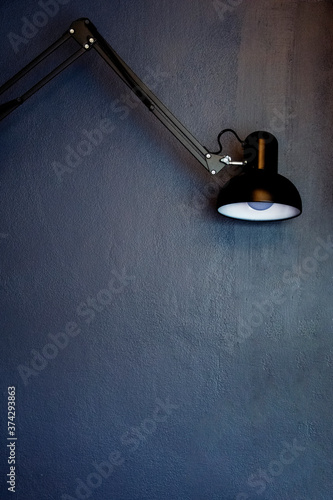 lamp on on dark blue wall background