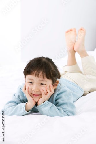 Wallpaper Mural girl lying on a bed Torontodigital.ca