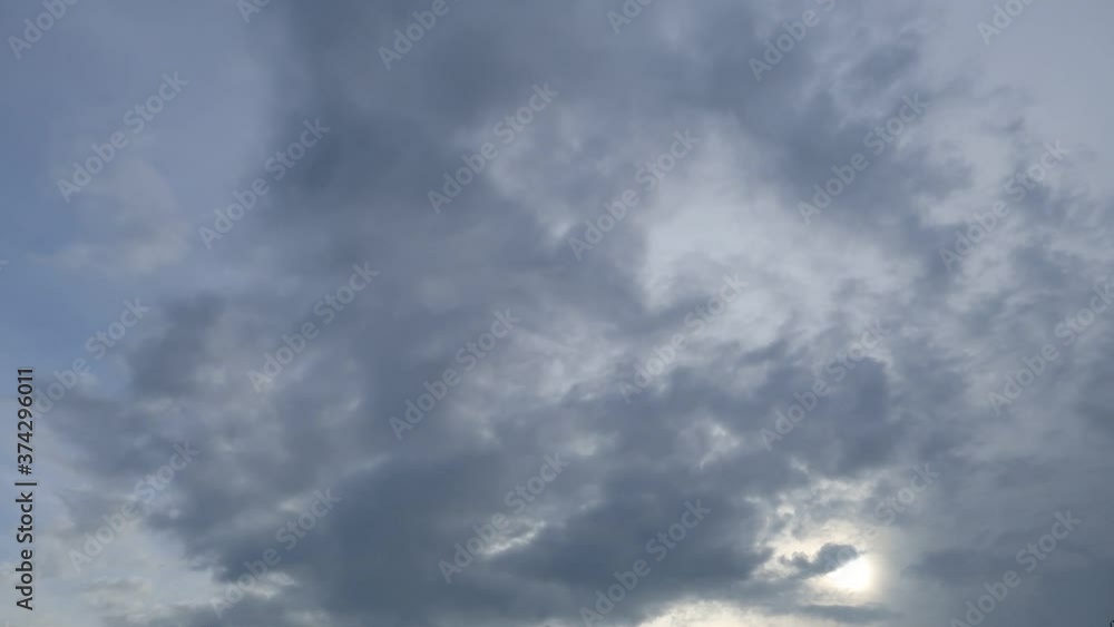 Dramatic b-roll TimeLapse of dark storm clouds & gray cumulus or cirrocumulus cloudscape slowly moved on bright sunrise sky with sun light rays & sunbeam shining through tropical summer horizon Dramatic b-roll TimeLapse of dark storm clouds & gray cumulus or cirrocumulus cloudscape slowly moved on bright sunrise sky with sun light rays & sunbeam shining through tropical summer horizon