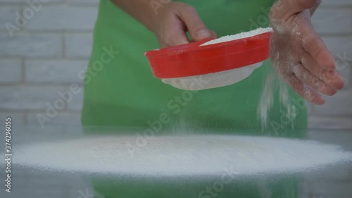 Wallpaper Mural Shake sieve for baking. A woman is sifting flour on the table through a sieve. Torontodigital.ca
