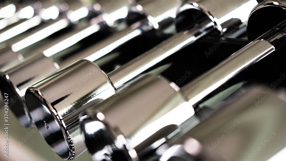 Metal polished one-handed weights on a stand Metal polished one-handed weights on a stand