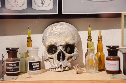Human skull jars with poison background.