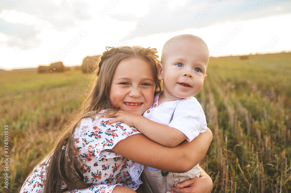 Closeup of two kids posing in wheat field. Closeup of two kids posing in wheat field.