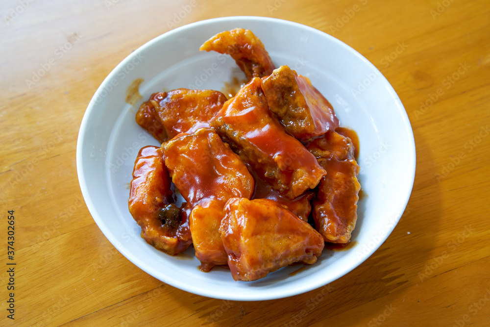 Chinese family dish, fried fish in tomato sauce Chinese family dish, fried fish in tomato sauce