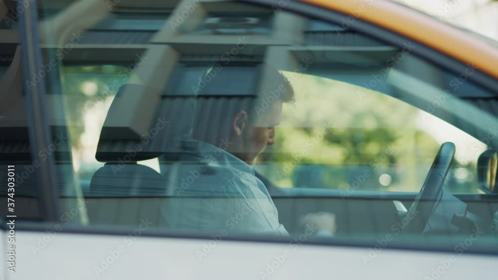 Young driver gets into the car Young driver gets into the car