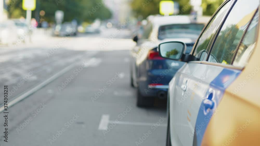 Young businessman getting into the car Young businessman getting into the car