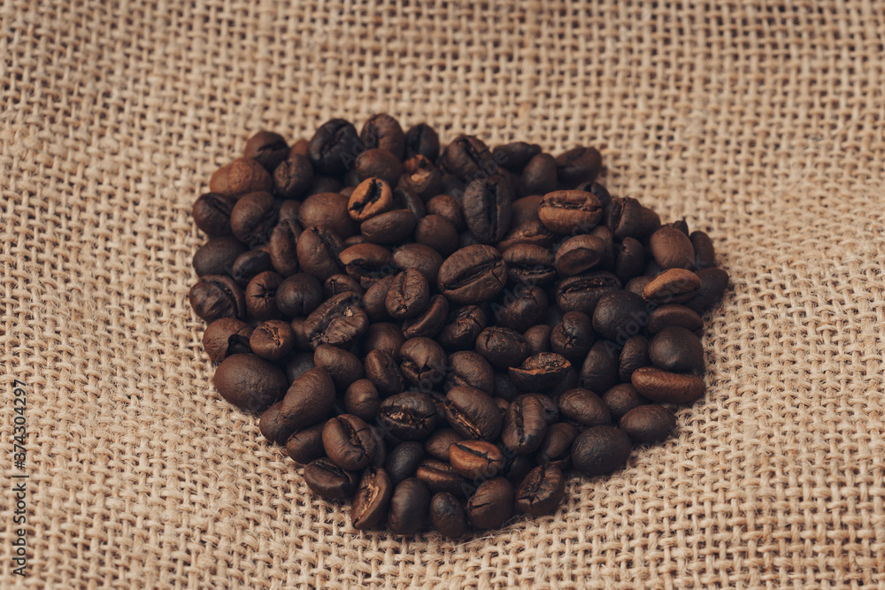 Jute burlack sack with roasted coffee beans Jute burlack sack with roasted coffee beans