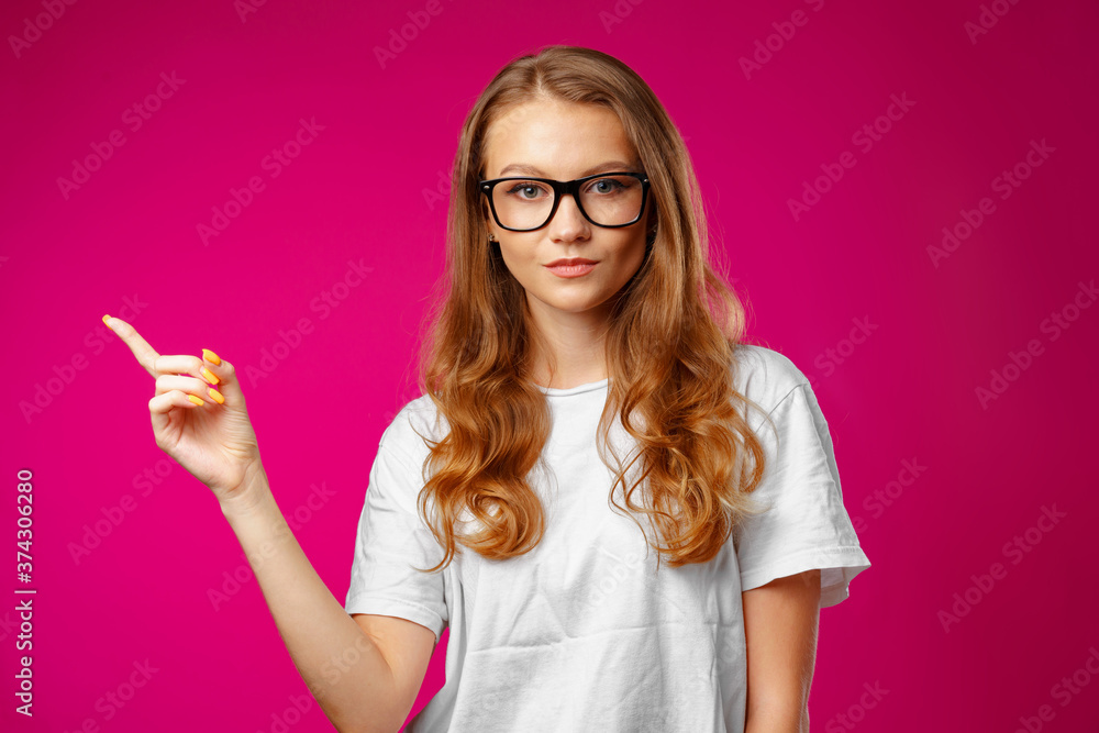 Portrait charming pretty cheerful girl showing copy space Portrait charming pretty cheerful girl showing copy space