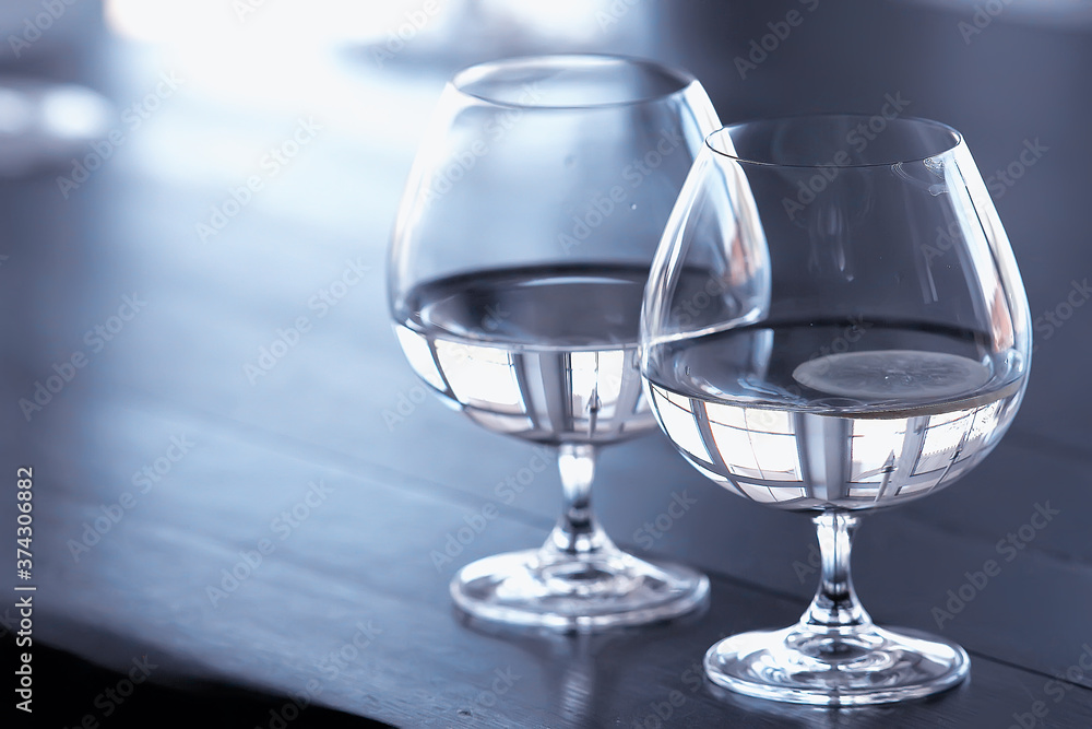 glass of water with ice in the restaurant / cold clear clear water in a glass with ice pieces glass of water with ice in the restaurant / cold clear clear water in a glass with ice pieces