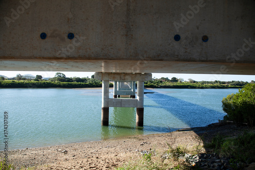 Underneath a new concrete bridge photo