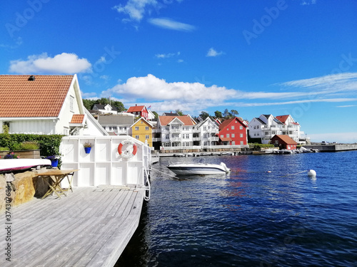 Beautiful shot of the houses near the sea from the village of Gjeving, Norway photo