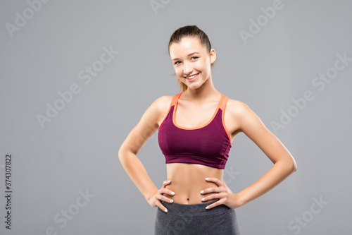 Pretty fitness woman on white isolated background