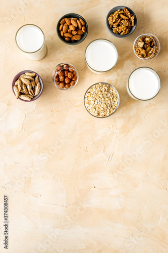 Above view of non-dairy milk alternative - almond hazelnut walnut oat milk
