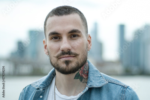 Portrait of young adult male in city