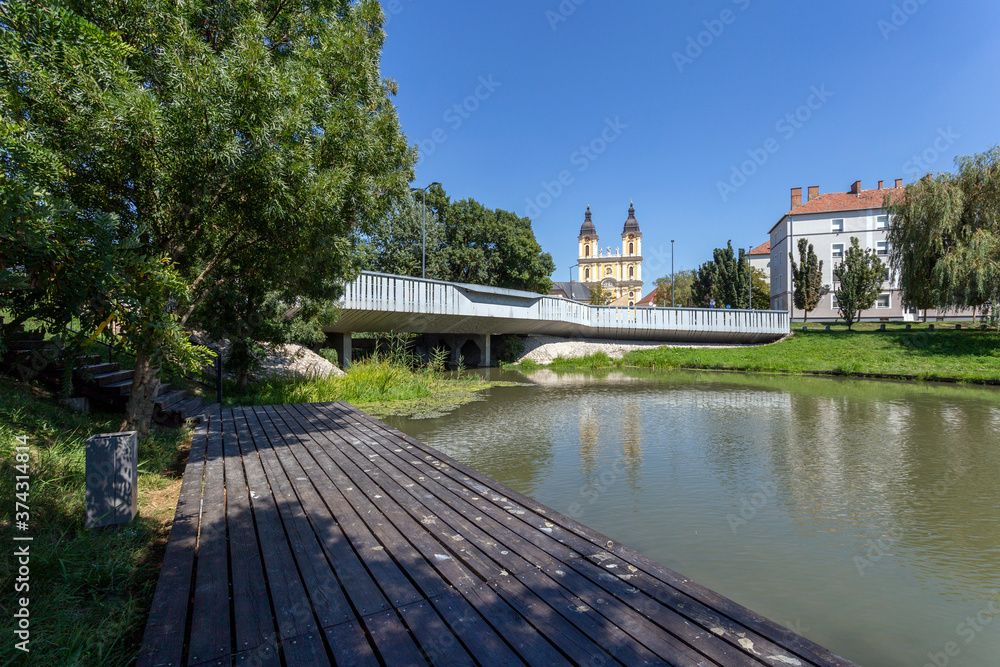 A cozy park in Kalocsa, Hungary with the St. Mary Cathedral in the background