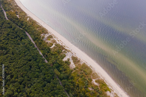 Billede på lærred Drone view strictly from above of curonian spit, diagonal of sea and forest