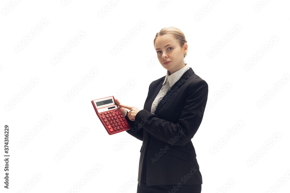 Working with calculator. Young woman, accountant, finance analyst or booker in office suit isolated on white studio background. Caucasian woman, office worker. Finance, economy, professional Working with calculator. Young woman, accountant, finance analyst or booker in office suit isolated on white studio background. Caucasian woman, office worker. Finance, economy, professional