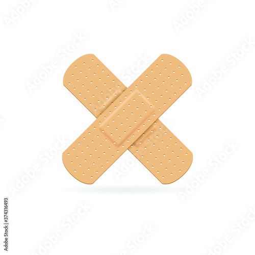 Cross adhesive bandage on white background