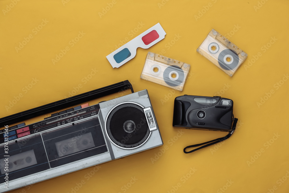 Fototapeta premium Retro old school attributes 80s on yellow background. Top view. Flat lay