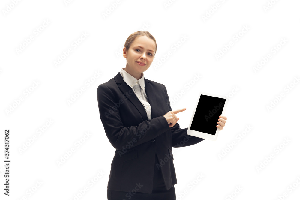 Pointing on blank screen. Young woman, accountant, finance analyst or booker in office suit isolated on white studio background. Caucasian woman, office worker. Finance, economy, professional Pointing on blank screen. Young woman, accountant, finance analyst or booker in office suit isolated on white studio background. Caucasian woman, office worker. Finance, economy, professional