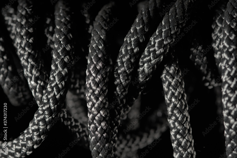Black twisted rope on a black background