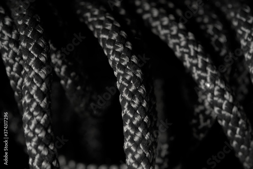 Black twisted rope on a black background